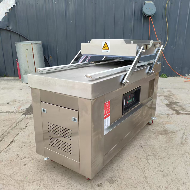 Double chamber vacuum packaging machine